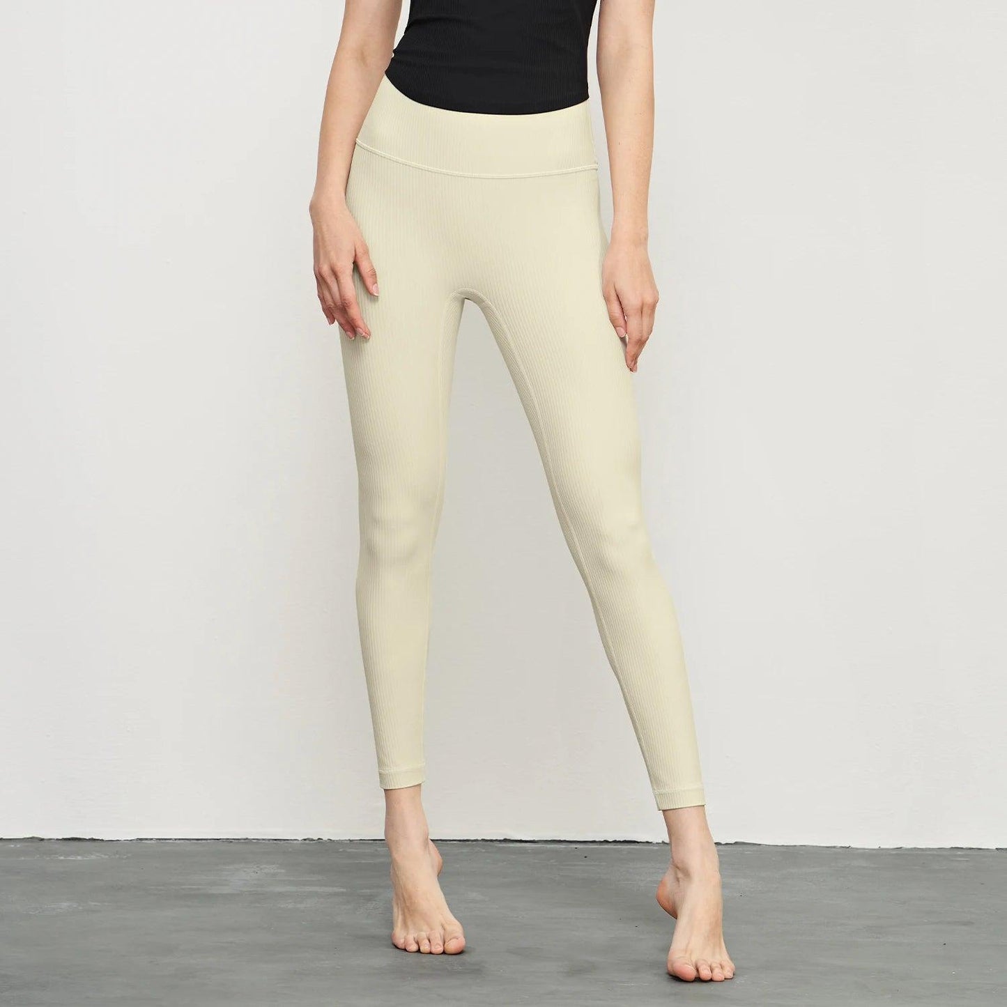 Black high-waisted leggings for women, made from breathable fabric, perfect for workouts or casual wear.